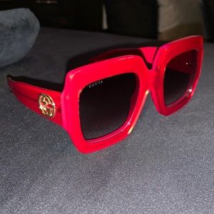 Women’s red Gucci sunglasses